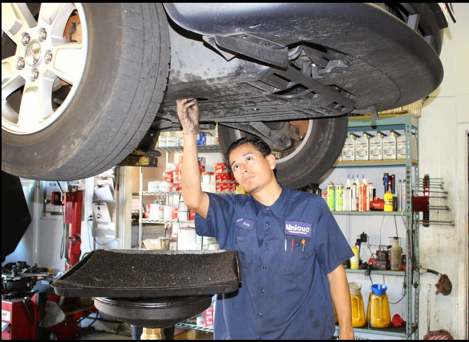Gary working under a vehicle on the lift